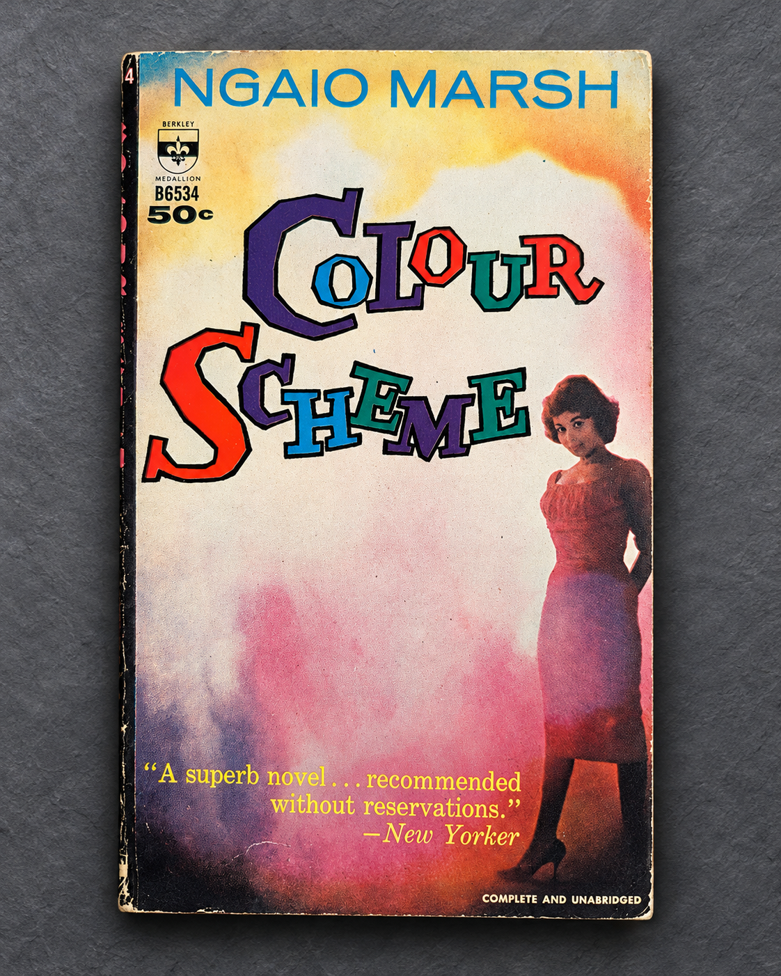 Colour Scheme paperback photographed on gray slate background