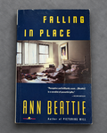 Falling in Place book cover on gray slate background