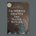 The Water Dancer by Ta-Nehisi Coates — original physical book on gray slate background