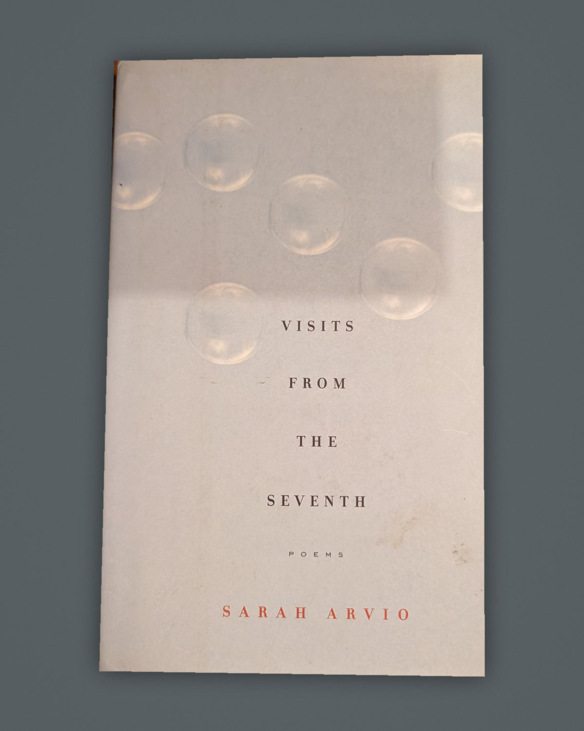 Visits from the Seventh — Sarah Arvio book cover on slate-gray background