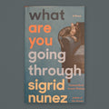 What Are You Going Through by Sigrid Nunez — original physical book on gray slate background